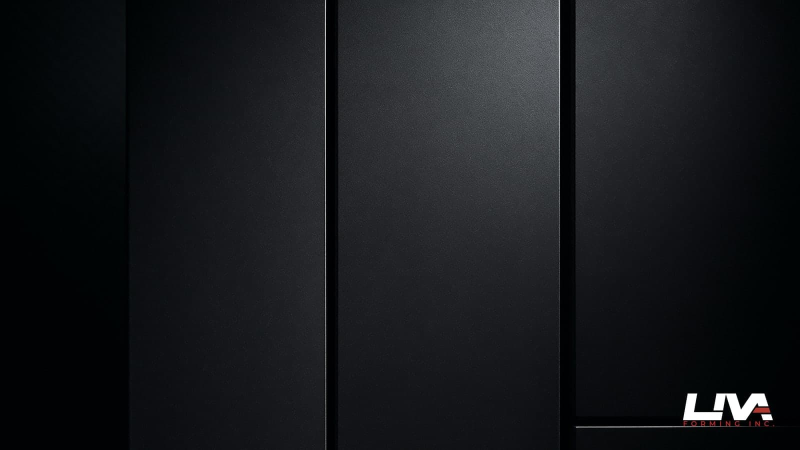 Graphite metal reveal panels with crisp shadow gaps lit dramatically from the side